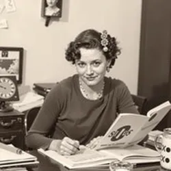 A vintage photo of Clara Pendrake at her writing desk