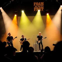 The Foam and Fret band performing on stage