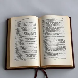 A book with pages showing both light and dark intertwining