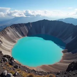 The Azure Eye, a turquoise caldera lake atop Mount Cinderfang, reflects the geothermal activity and mineral richness of the volcano.