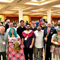 Attendees at the Chrono Lore Convention showcasing their dinosaur-themed costumes.